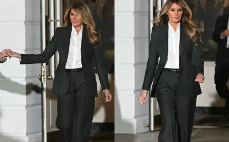 Melania Trump Brings Back Political Power Dressing In Dark Grey Pantsuit